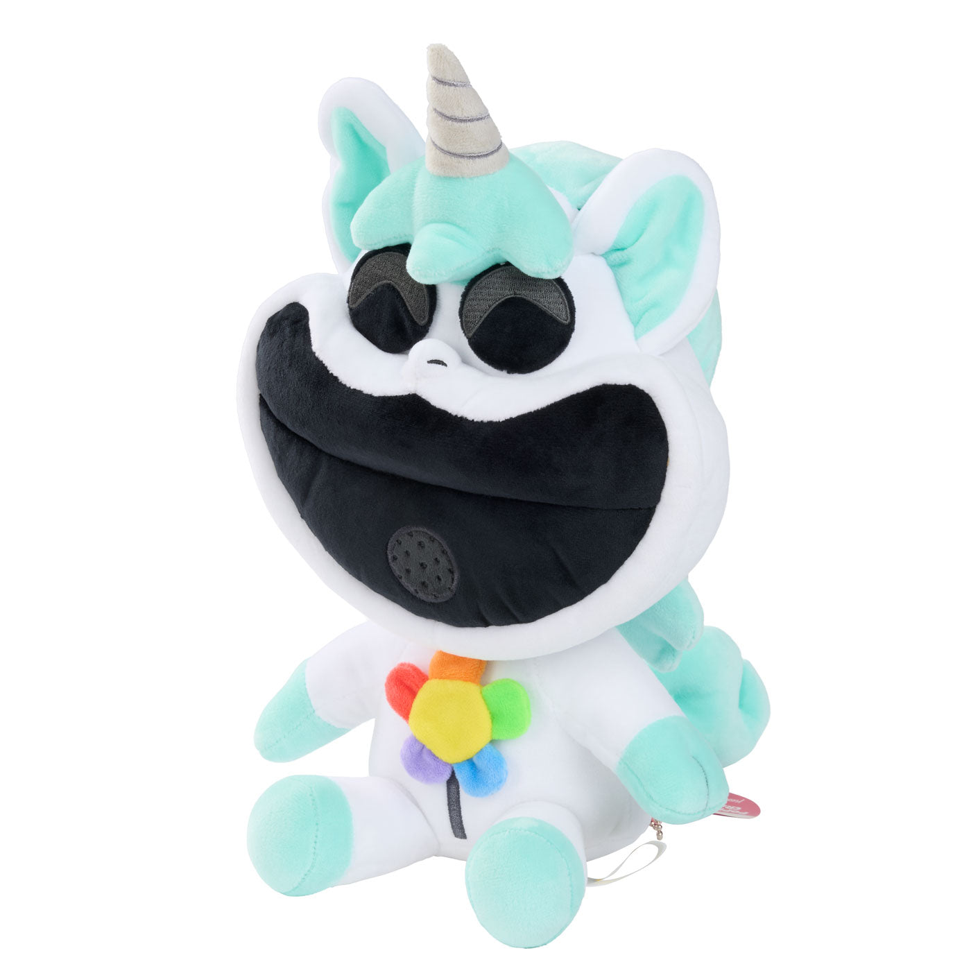 A plush unicorn with a large black mouth, mint green and white body, a striped horn, and a small rainbow flower accessory on its chest.