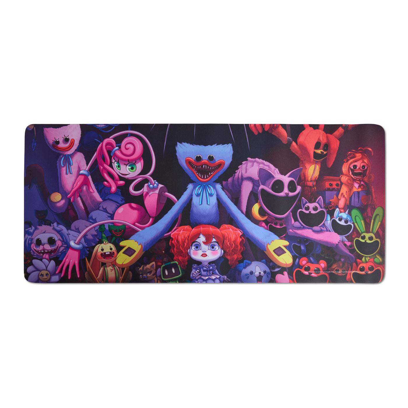 Desk Mat with Poppy Playtime characters gathered around Huggy Wuggy in the center, with other toy characters including Mommy Long Legs, CatNap, and Smiling Critters shown in a dark, neon-lit toy factory setting. The image uses vibrant pink, blue, purple, and red tones with a playful yet spooky atmosphere.